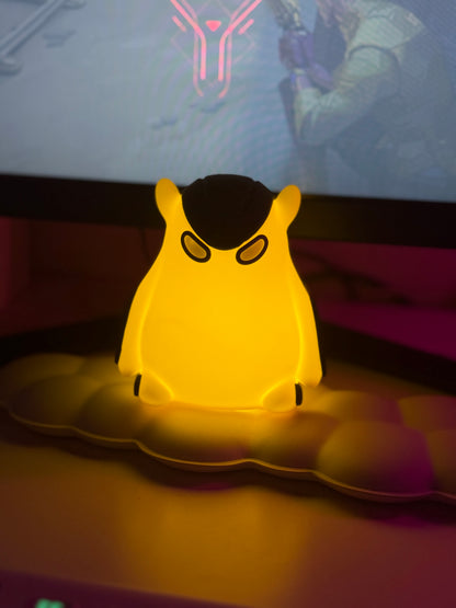 Yellow glowing object resembling a cartoon character on a dark background
